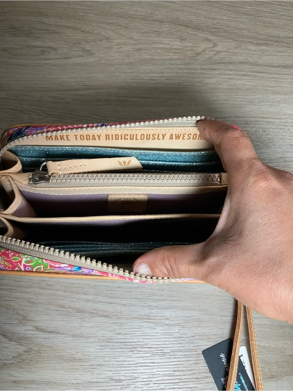 Consuela Pink Floral Embossed Zip Wristlet with Tan Strap